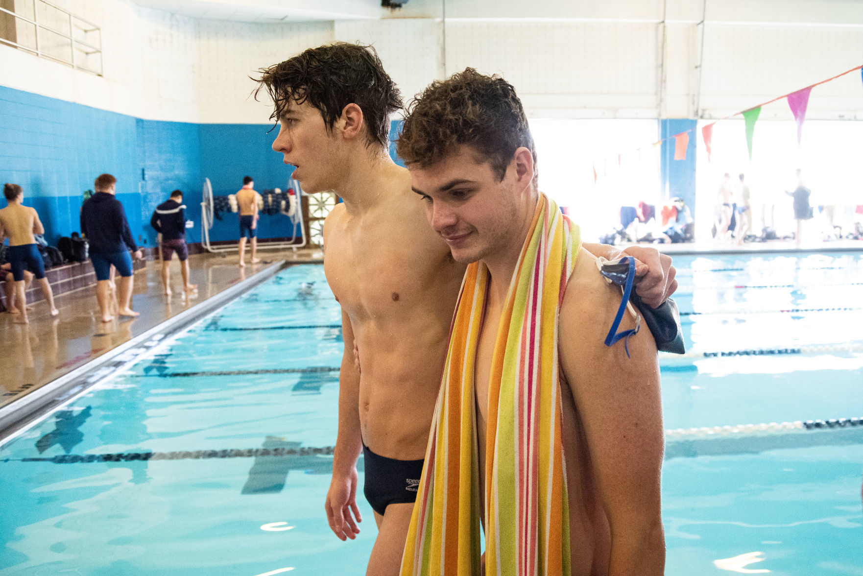 Egan Dritz puts his arm around Xander Say, left, after Say came in second place in the 100 yard freestyle.